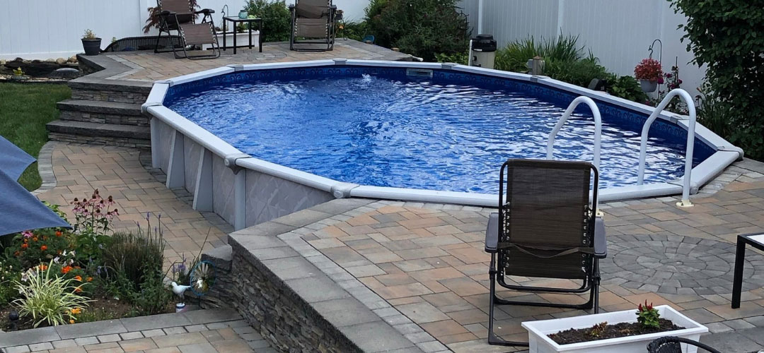 Gray Paver Decking, Above Ground Pool’s Blue Water