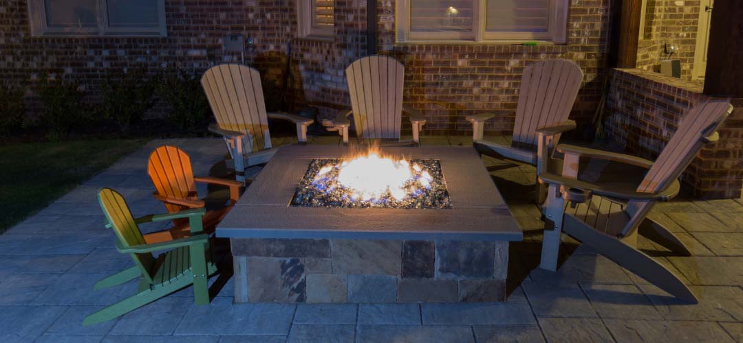 fire pit table with Adirondack chairs