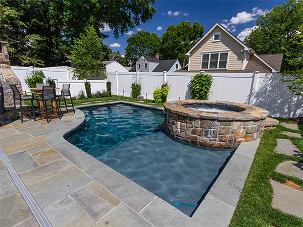 Backyard Pool with Spa,Outdoor Living Space | NPT QuartzScapes Barbados Blue Pool Finish 