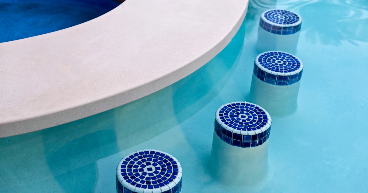 blue tile covered stools built into pool 