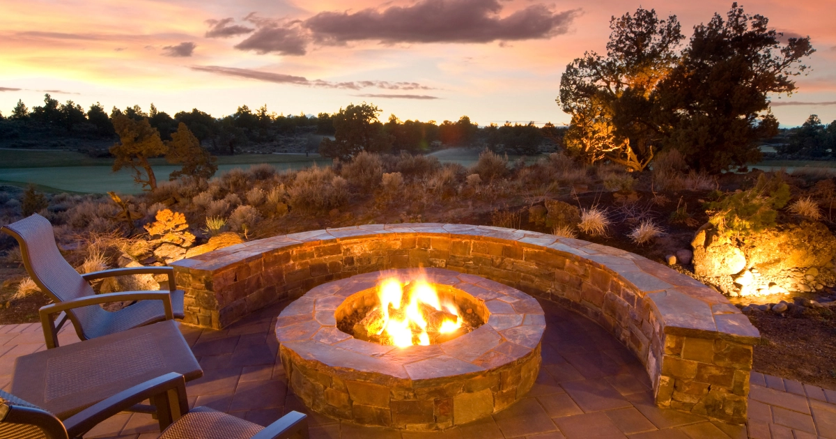 outdoor fire pit with golf course in background
