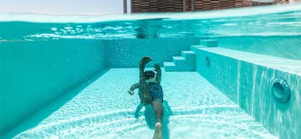 Kid Swimming Underwater | Pool Wellness